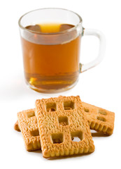 isolated image of a cup of tea and cookies closeup