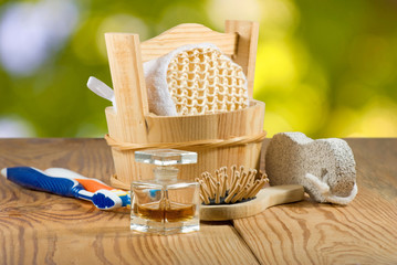 Image of bath accessories on wooden board closeup