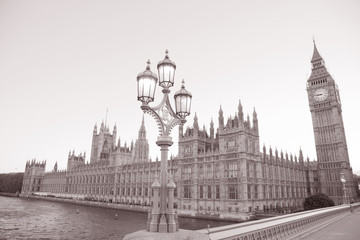 Fototapeta na wymiar Lamppost and Houses of Parliament, London, England, UK in Black and White Sepia Tone