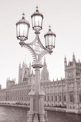 Fototapeta na wymiar Lamppost and Houses of Parliament in Black and White Sepia Tone in London, England, UK