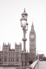 Westminster Bridge and Lamppost and the Houses of Parliament and Big Ben; London; England, UK in Black and White Sepia Tone