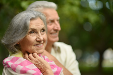 Obraz premium mature couple in summer park