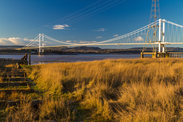 Remains of Aust Ferry pier with Severn Bridge in the distance