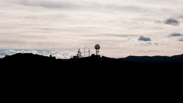 Radar and antenna over mountain time-lapse