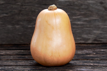 Fresh butternut squash on wooden table