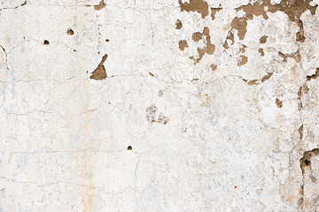 Old, grungy white background of natural plaster wall surface.