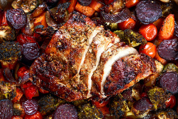 Juicy roast pork on the plate with vegetables