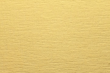 Yellow non-woven wallpaper for painting. Yellow, orange background abstract design texture. 