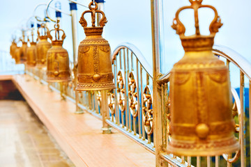 Religion, Buddhism. Closeup Prayer Bells In A Buddhist Temple Of Thailand. 