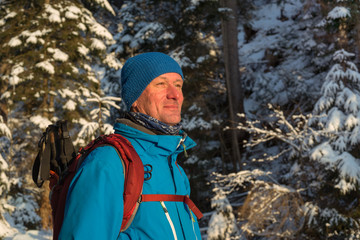 Hiker man in the winter wood