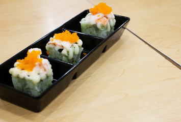 salmon sushi with nori and wasabi