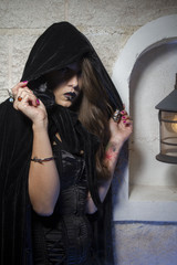 goth, young beautiful gothic girl with black lace dress and dark