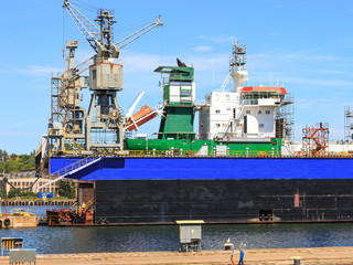A big ship on the dry dock in a shipyard Gdynia, Poland.