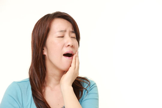 Japanese woman suffers from toothache 
