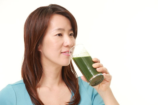 Japanese woman with green vegetable juice