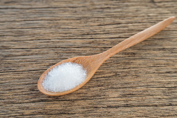 Monosodium glutamate,Wooden spoon,Wooden floor.