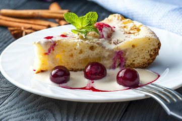 Piece of pineapple pie, ice cream and cherries 