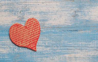 Crate paper Heart,Red heart,Blue wooden floor.