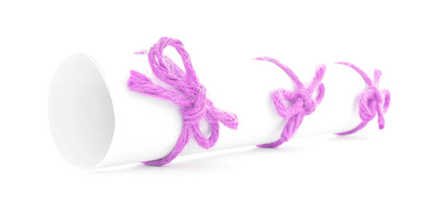 White message roll tied with string, three pink bows isolated