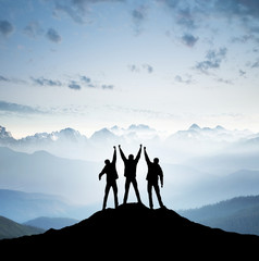 Team on mountain top. Active life concept
