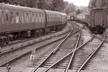 Railway Track with Train Carriages in Black and White Sepia Tone