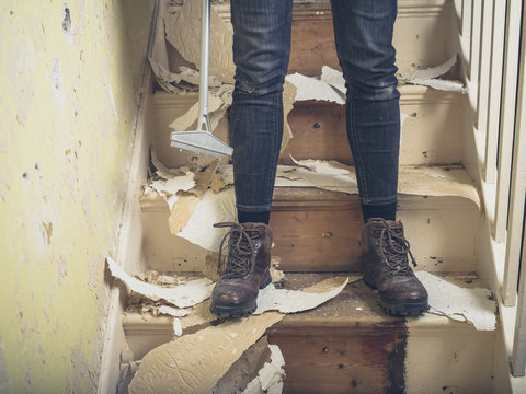 Person renovating on stairs