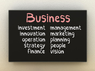 Business on black board. Business concept.