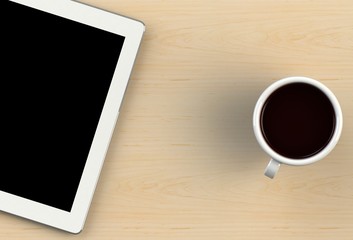 Coffee cup with tablet on wood table