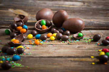 Chocolate Easter Eggs Over Wooden Background