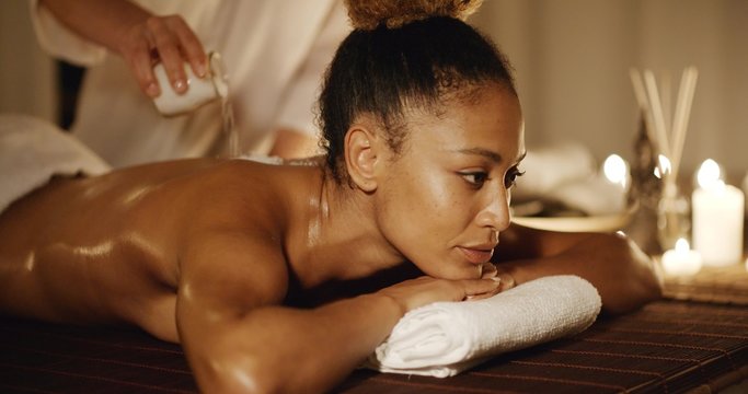 Body massage with marine salt in a spa in slow motion