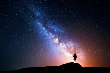Milky Way. Night sky with stars and silhouette of a man
