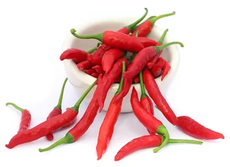 Fotobehang Red chili peppers in a ceramic bowl © Swapan