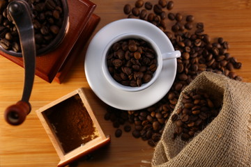 manual coffee grinder ,beans and cup