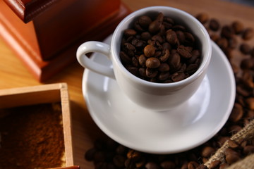 manual coffee grinder ,beans and cup