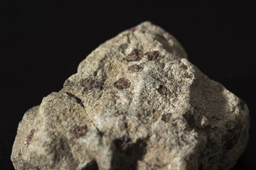 pyrope in the rock, tiny crystals of garnet