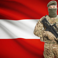 Soldier with machine gun and flag on background - Austria
