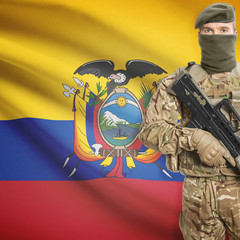 Soldier with machine gun and flag on background - Ecuador