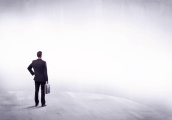 Business person standing from rear view