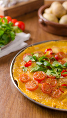Frittata with tomatoes, herbs and chilli