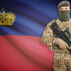Fototapeta premium Soldier with machine gun and flag on background - Liechtenstein