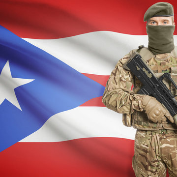 Soldier with machine gun and flag on background - Puerto Rico