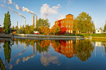 Old factory red brick buildings by the canal