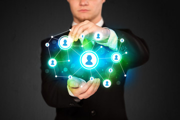 Businessman holding social media network