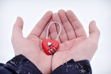 Red Heart-shaped Combination Lock at man's palms