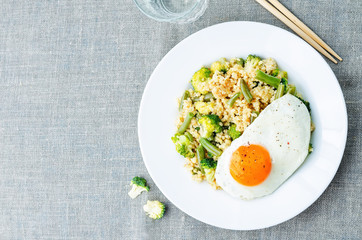 stir fried millet with broccoli, green beans and fried egg