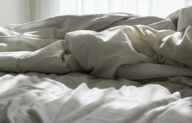 Fototapeta na wymiar Blanket with sunlight on the bed