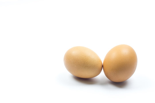 Two brown chicken egg isolated on white