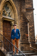 man in beige pants and a blue blazer