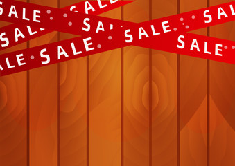 Red tape with the word "Sale" on a wooden background