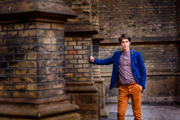 man in beige pants and a blue blazer